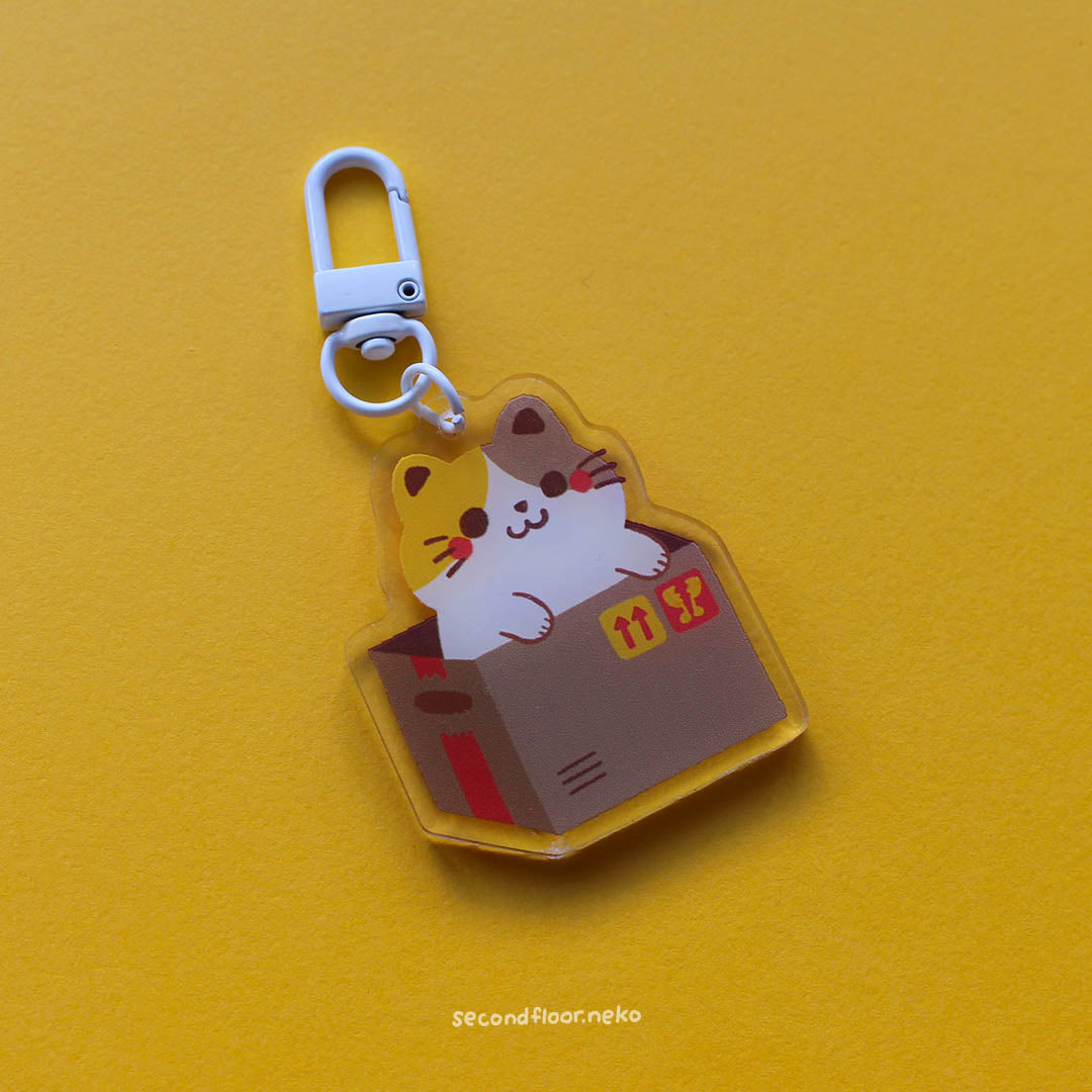 Cats in boxes keychain